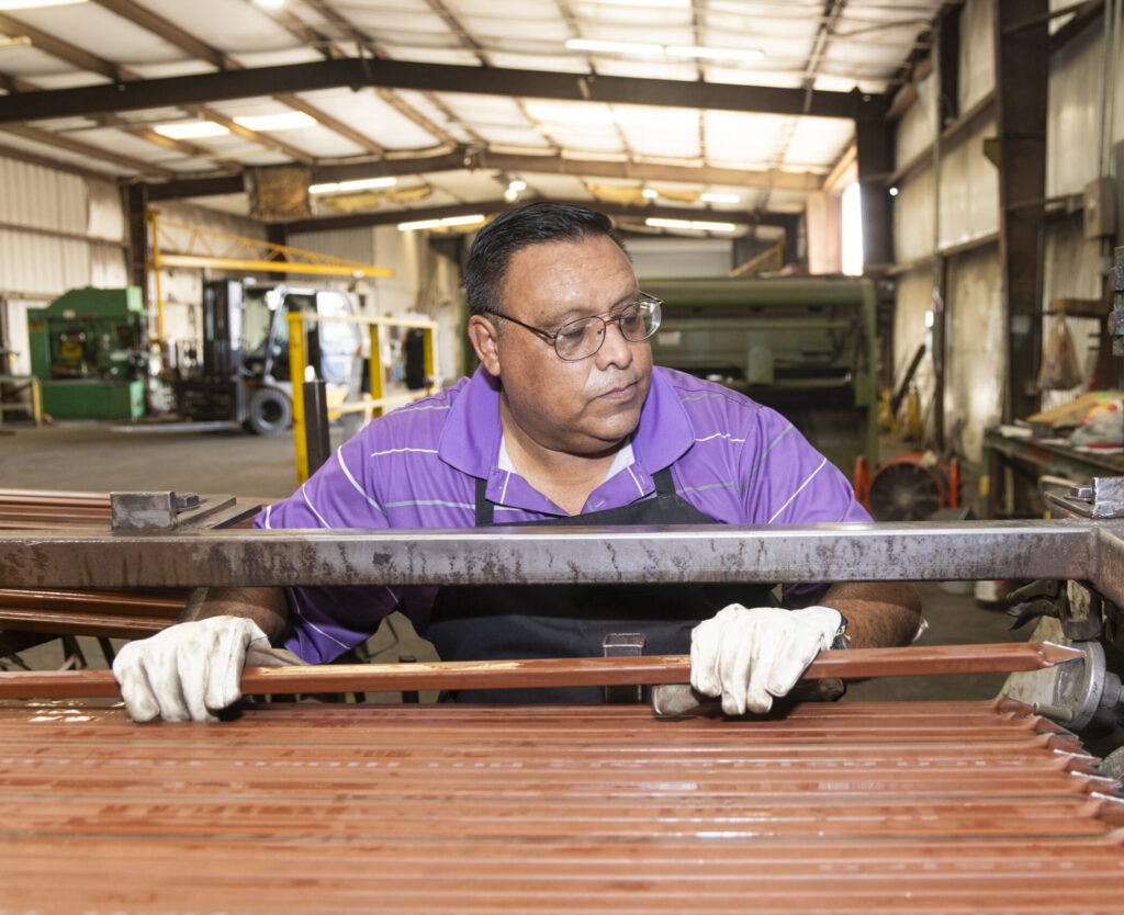 A man working with steel at Eagle National Steel