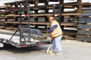 A man loading up a trailer at Eagle National Steel