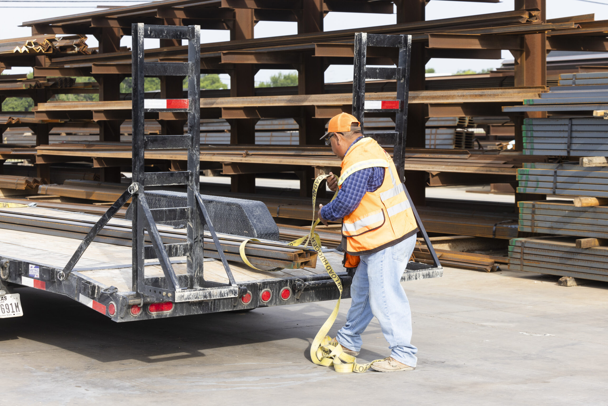 A man loading up a trailer at Eagle National Steel