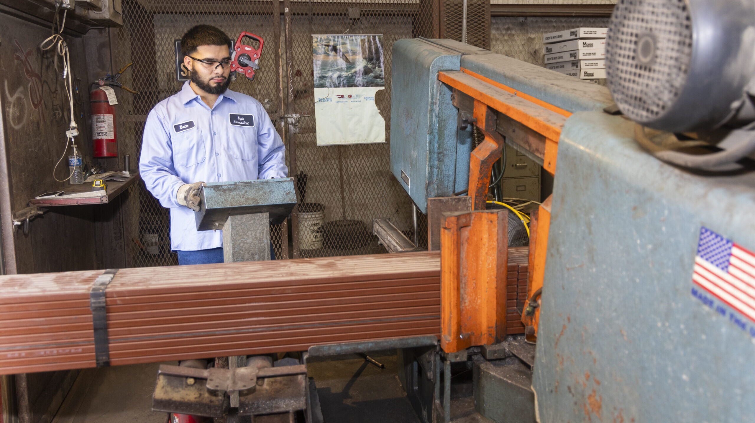 A man working machinery at Eagle National Steel